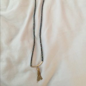Bead and gold tone tassel necklace